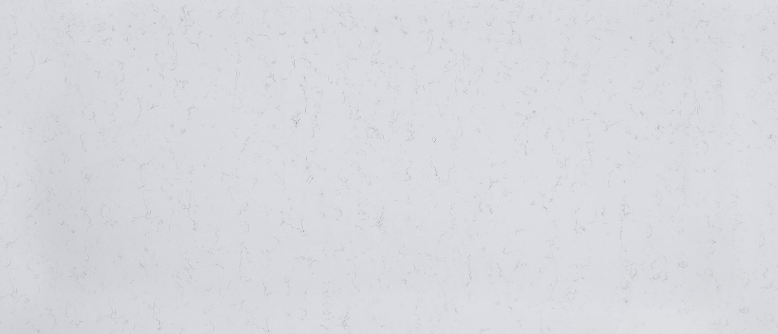 Carrara Breve quartz with subtle soft veining on a warm white background