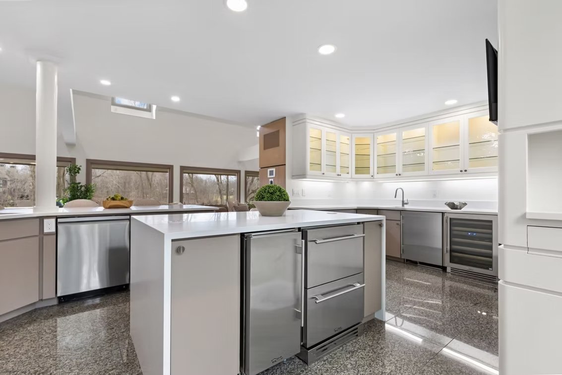 J & R white modern kitchen with custom stone island