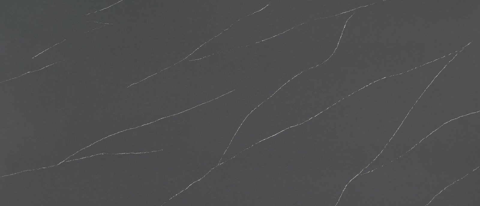 Soapstone Metropolis quartz with a deep grey background and white veining